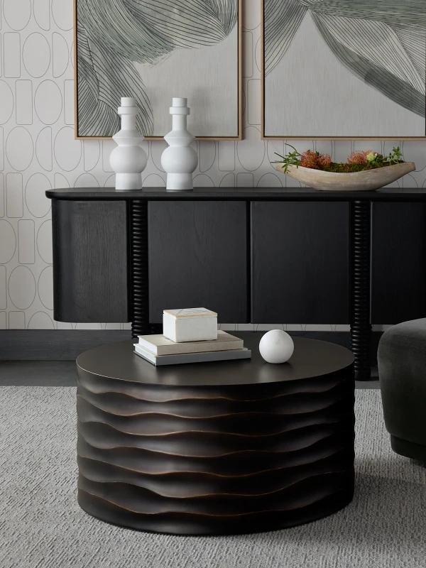 Black round coffee table in contemporary living room