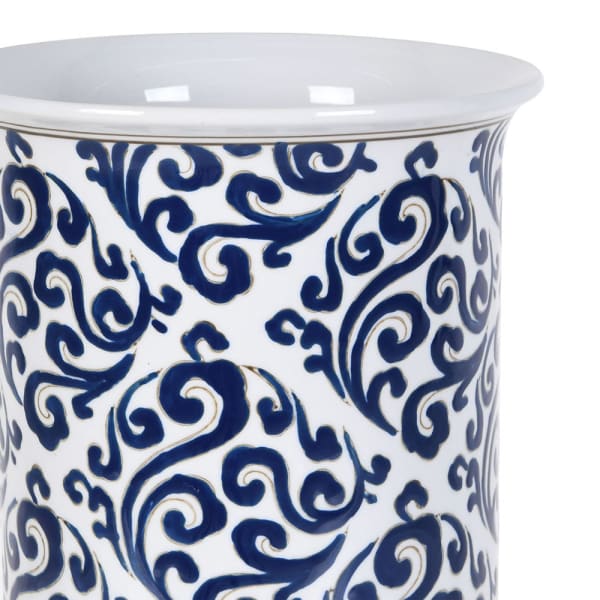 Close-up of navy blue botanical scrollwork on Boscobel white porcelain umbrella stand