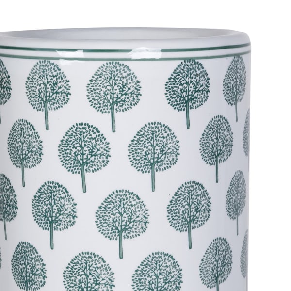 Close-up of delicate green botanical tree motifs on Richmond ceramic umbrella stand