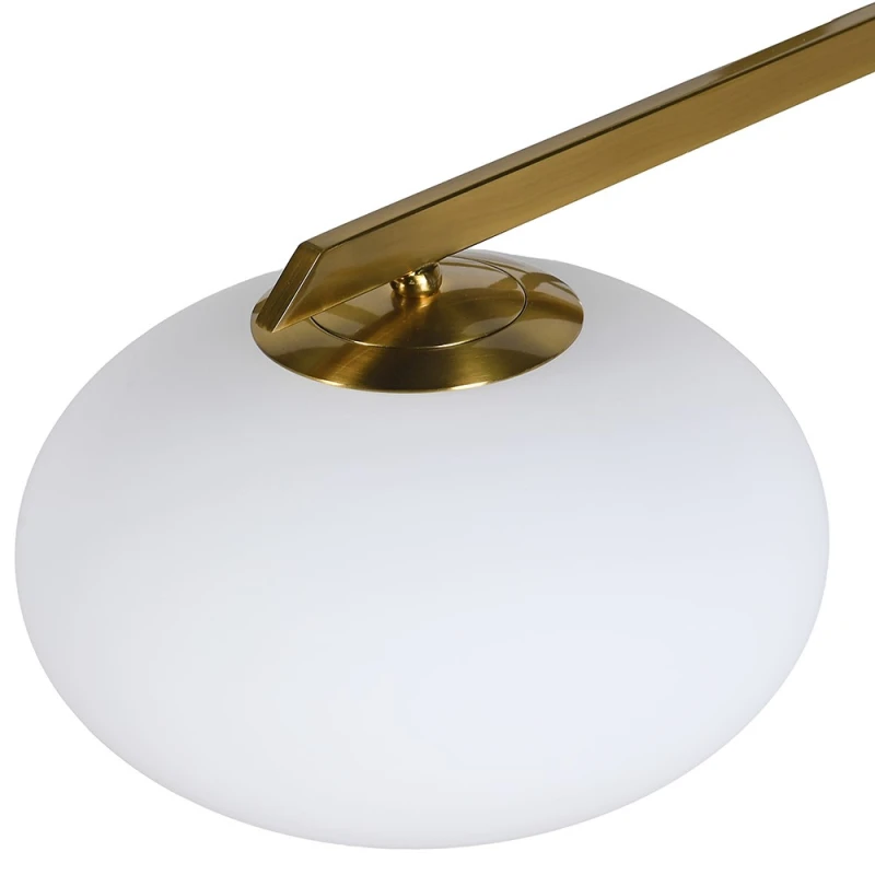 Close-up of white glass globe shade and gold metal arm on Bromley chandelier