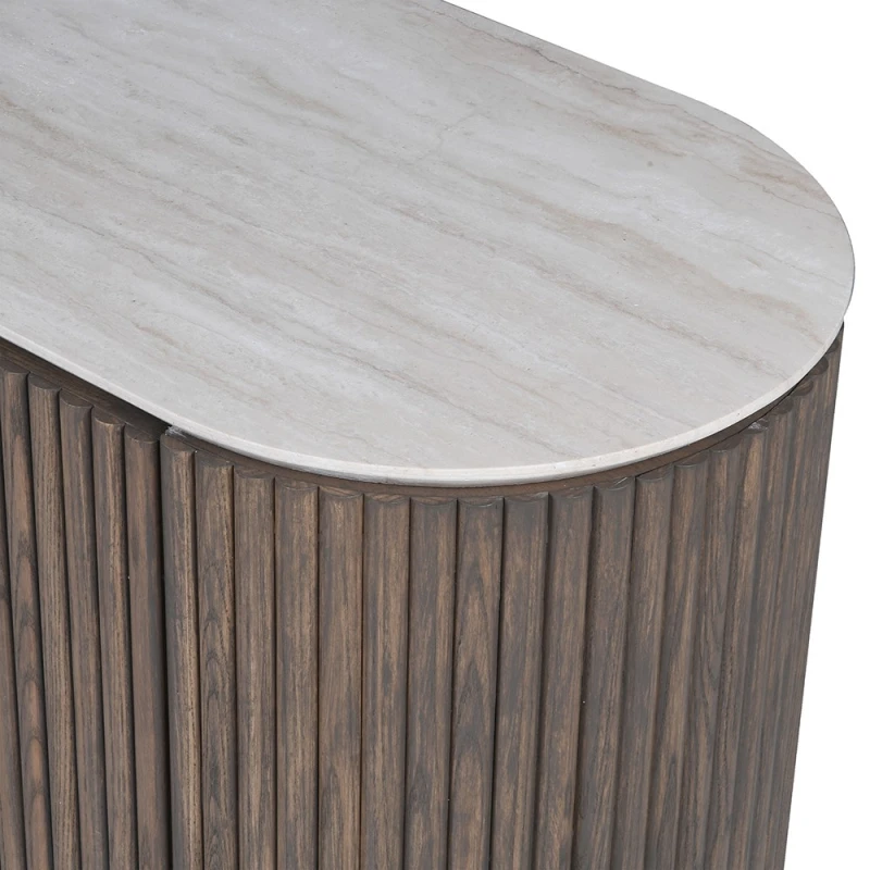 Pale marble top with subtle veining and rounded edge above fluted ash veneer
