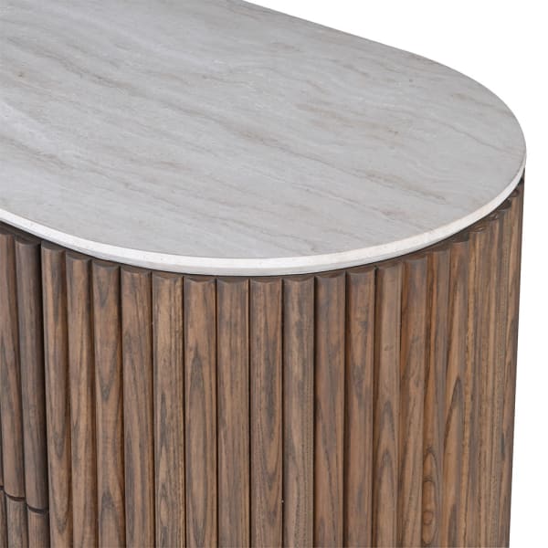 Pale marble top with natural veining and rounded edge on Ashford chest