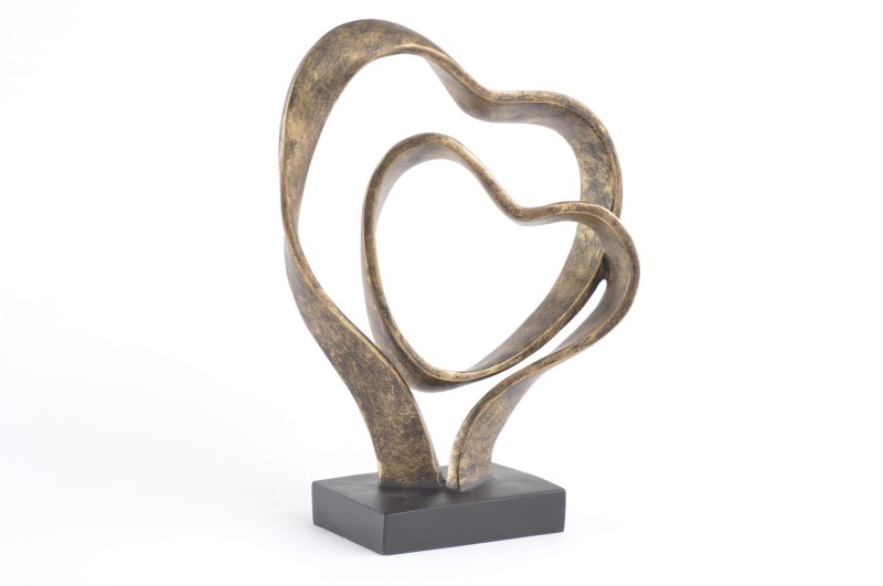 Decorative interlocking hearts sculpture on a black base