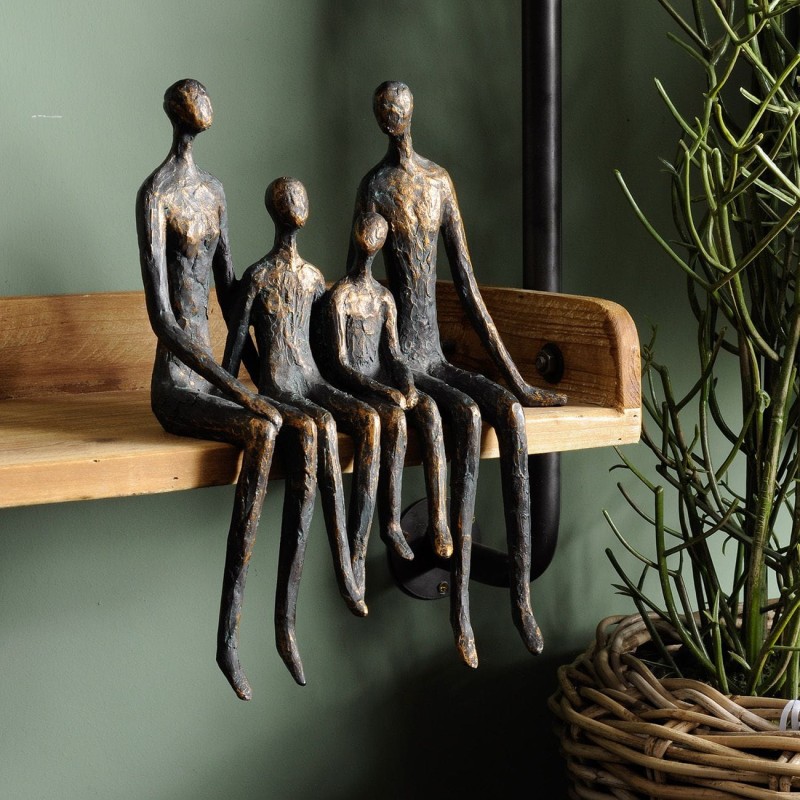 Four seated figures with legs hanging over a shelf