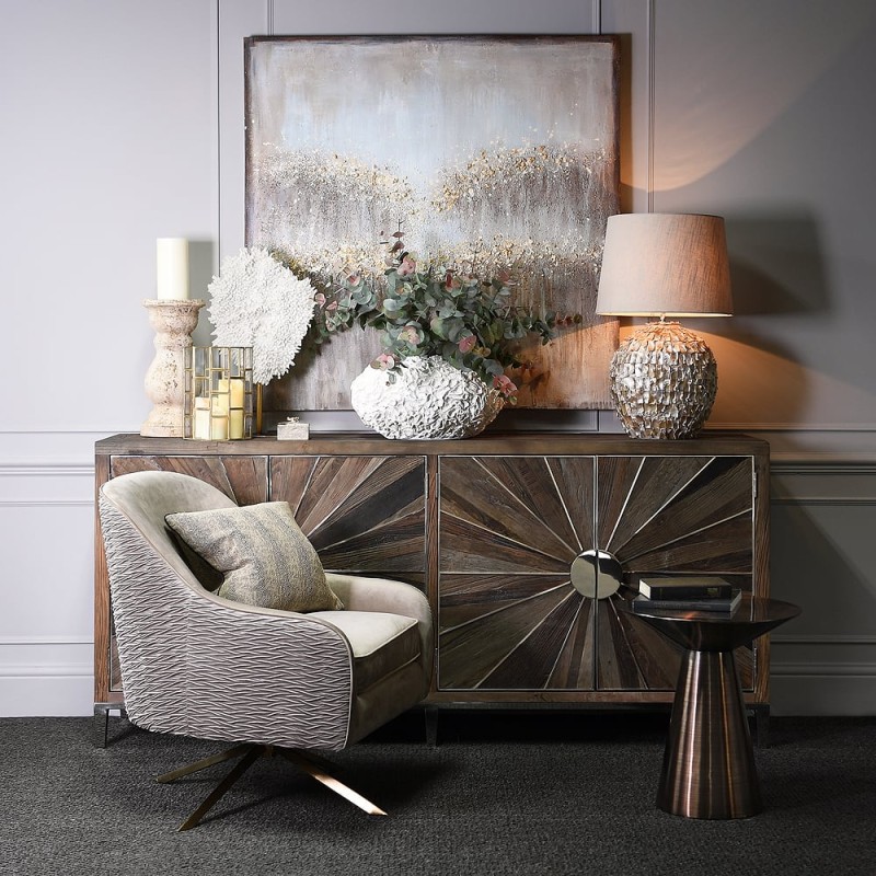 Knightsbridge beige velvet swivel armchair with brass base