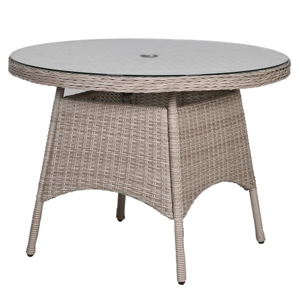 Rattan garden dining set for four with round glass-top table