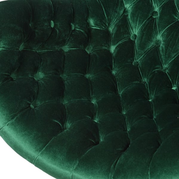 Button-tufted emerald armchair with curved upholstered arms