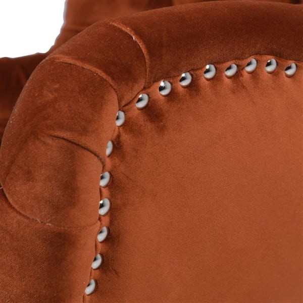 Close-up of metal stud detailing on the Boscobel Orange armchair