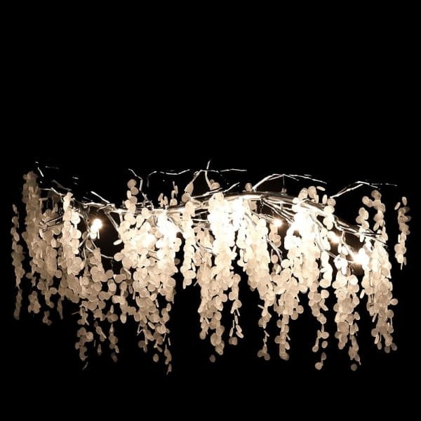 Linear white glass chandelier above a dining table