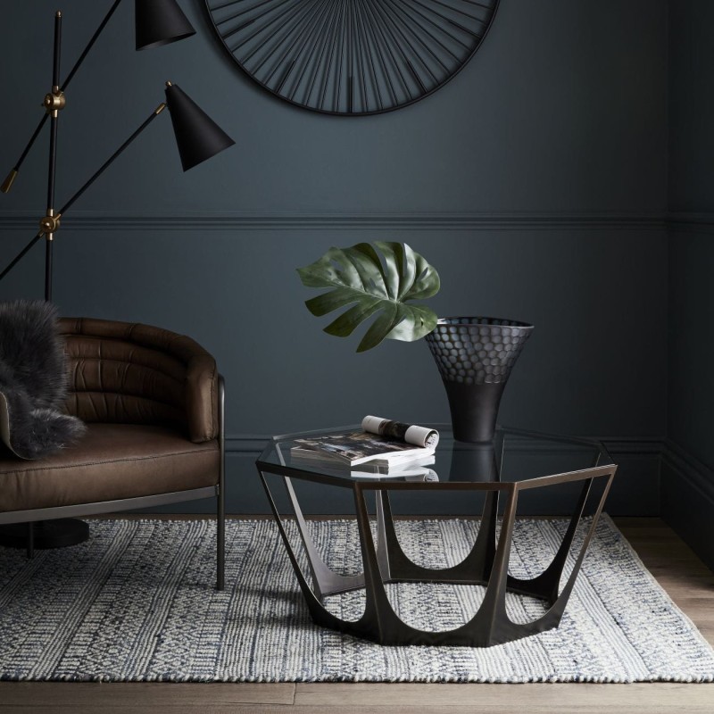 Brown coffee table with geometric iron base